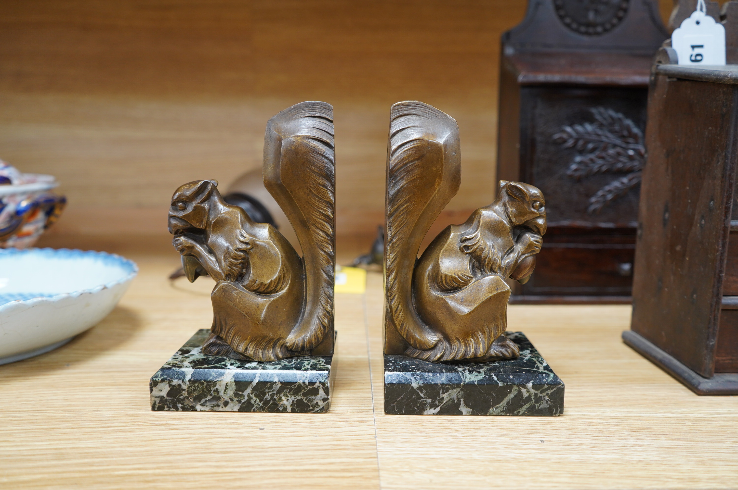 A pair of French Art Deco spelter squirrel bookends, on marble plinths, 18cm high. Condition - fair to good